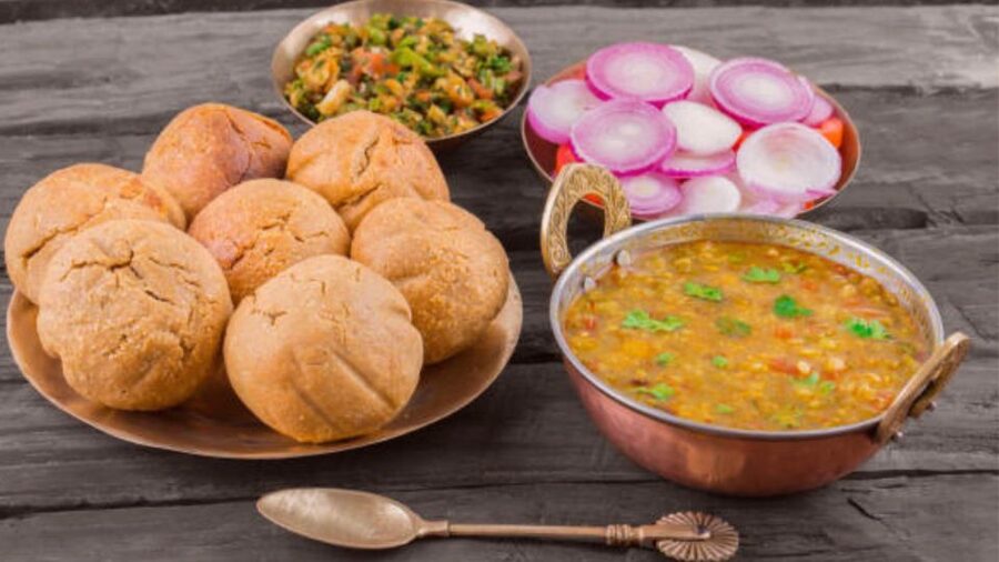 Farm to Table: With a local farmer family - Your Rajasthani meal: Dal Bati, saag, dumplings, and chaas