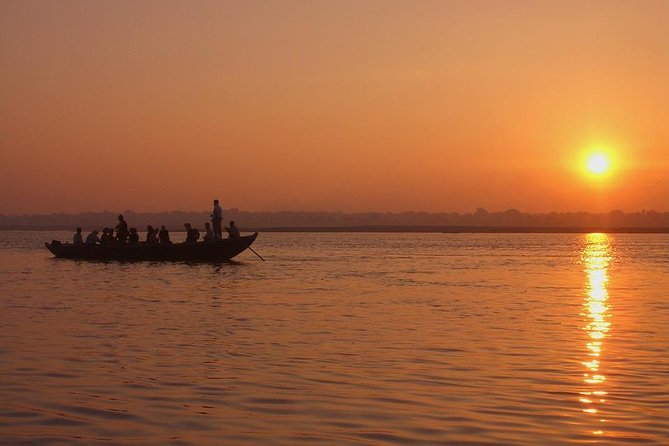 Varanasi: Sunrise Boat Tour and Heritage Walk with transfers - Manikarnika Ghat at dawn: passing colorful ghats by boat