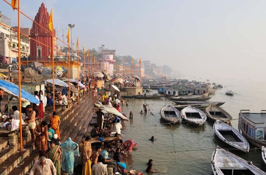 Varanasi Sunset Tour with Ganga Aarti & Free Boat Ride - Manikarnika Ghat by boat: the most sacred cremation ground, seen from the river